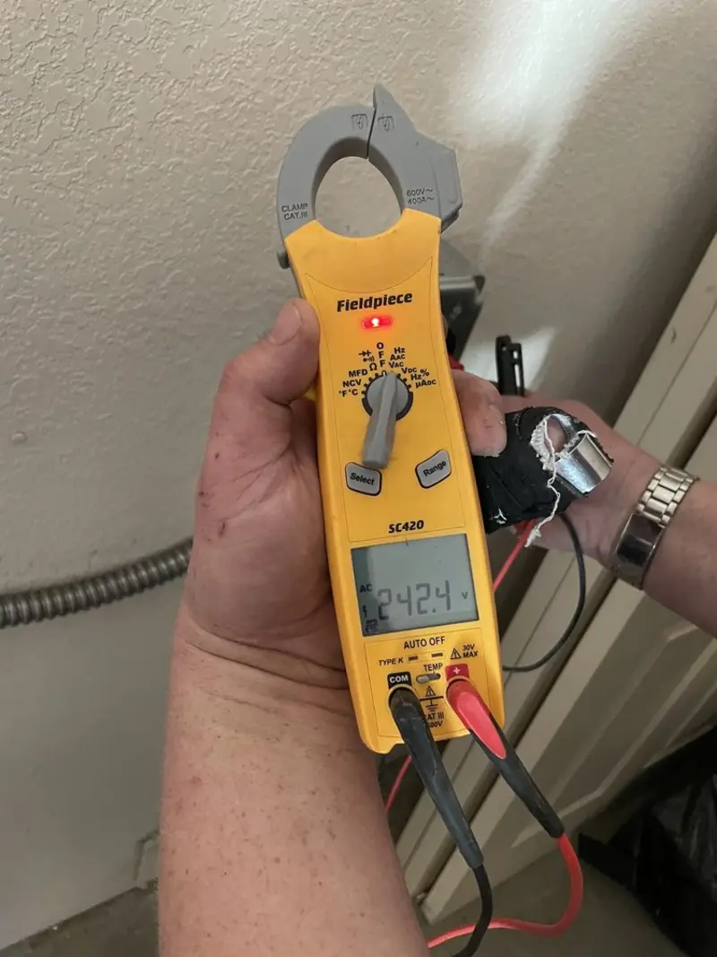 Voltage testing with clamp meter during Recessed Lighting Installation in Longswamp